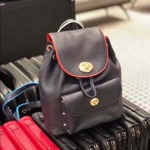 Coach mini backpack with rainbow belt